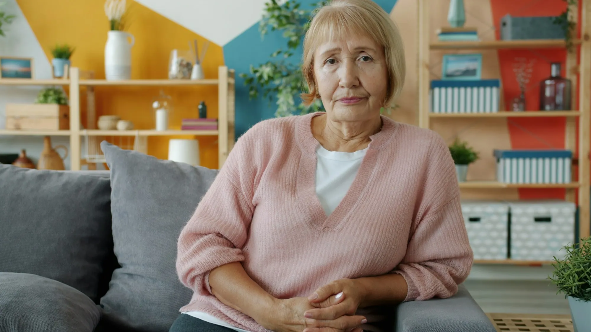 An older woman at home in the morning light
